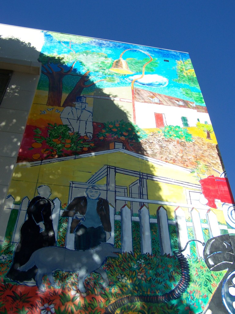 Day 17: Photograph of the Bailey House and Pio Pico sections of the mural facing Philadelphia St. at about 80% completion.