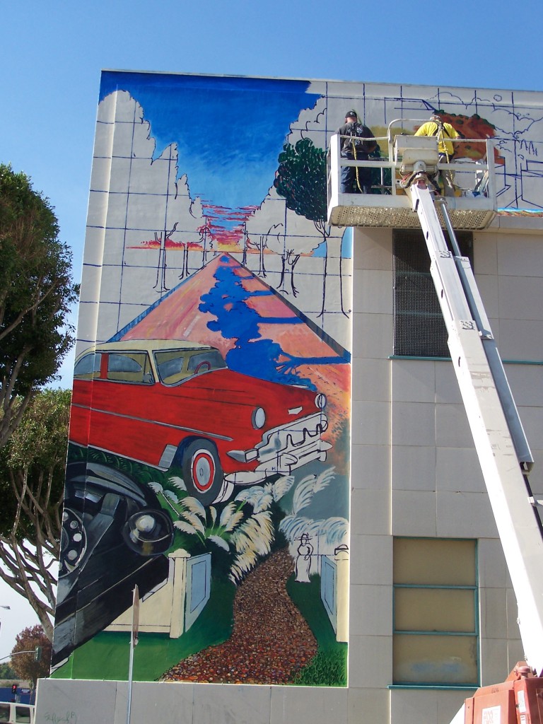 Day 5: Tyler Kinnaman and Dennis McGonagle work side by side on the Whittier Blvd. and Four Bricks sections of the mural.