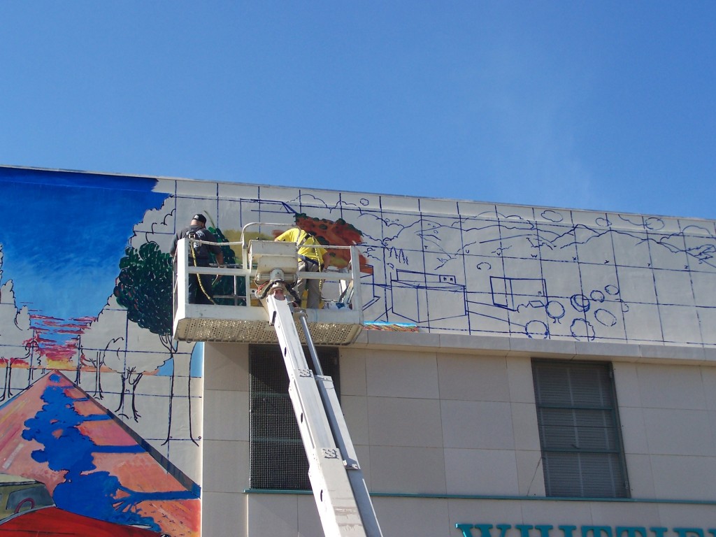 Day 5: Tyler Kinnaman and Dennis McGonagle work side by side on the Whittier Blvd. and Four Bricks sections of the mural.