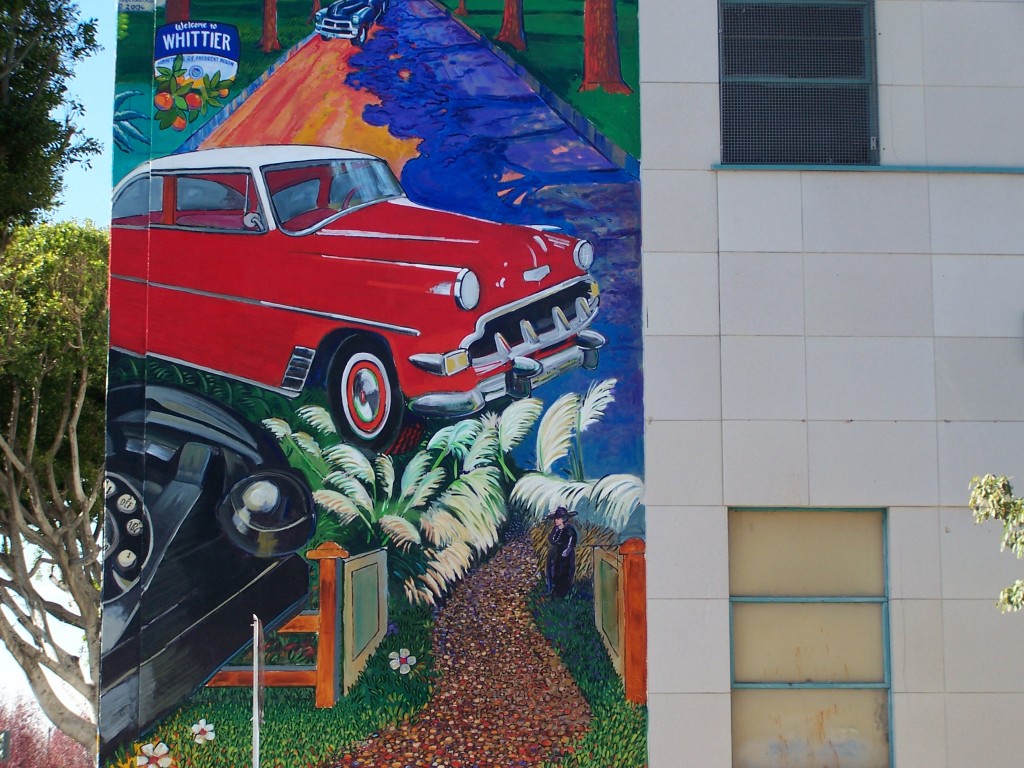 Finished mural: Photograph of the telephone, Chevy car, Harriet Russell Strong, Whittier Blvd., and Welcome to Whittier sign. This section faces Newlin Ave.