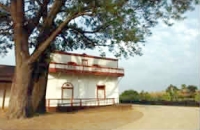 Photograph of front view of Pio Pico's mansion.