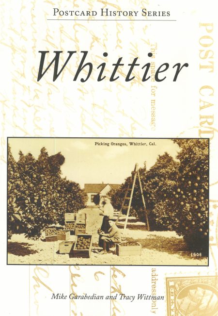 Image of book cover, Postcard History Series, Whittier. Image on cover shows a woman and boy harvesting citrus at their home grove.