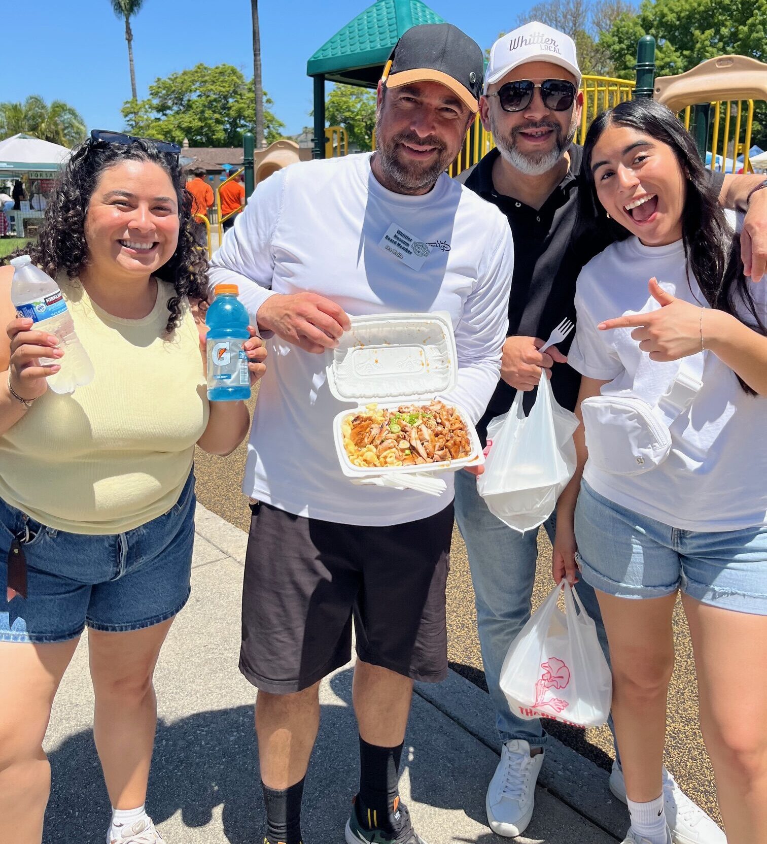 Group of people showing food available for purchase at Founders Day.